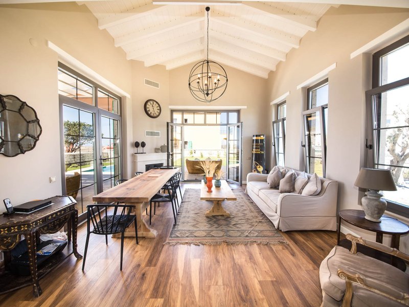 Bright lounge and dining area property photo used to generate a polished listing video