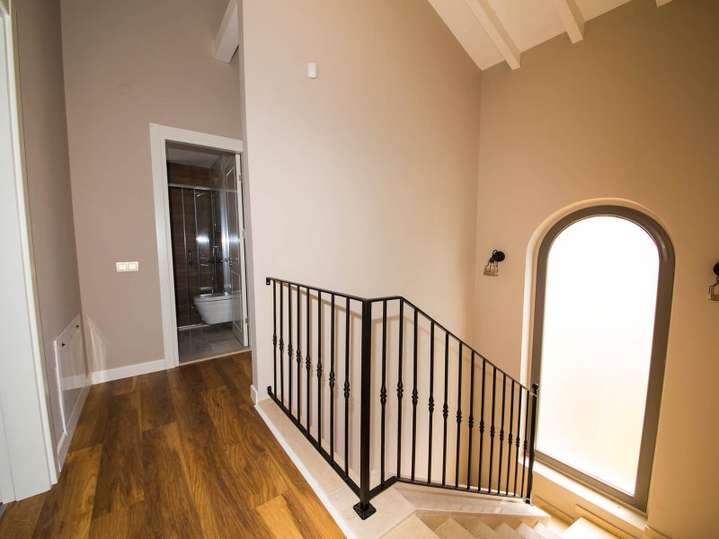 Hallway and stair landing property photo used as the sixth image in a real estate video example
