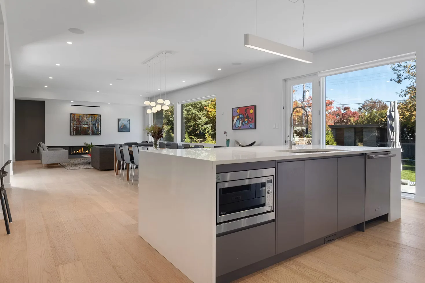 Open-plan designer kitchen and living area photographed for the luxury villa property video