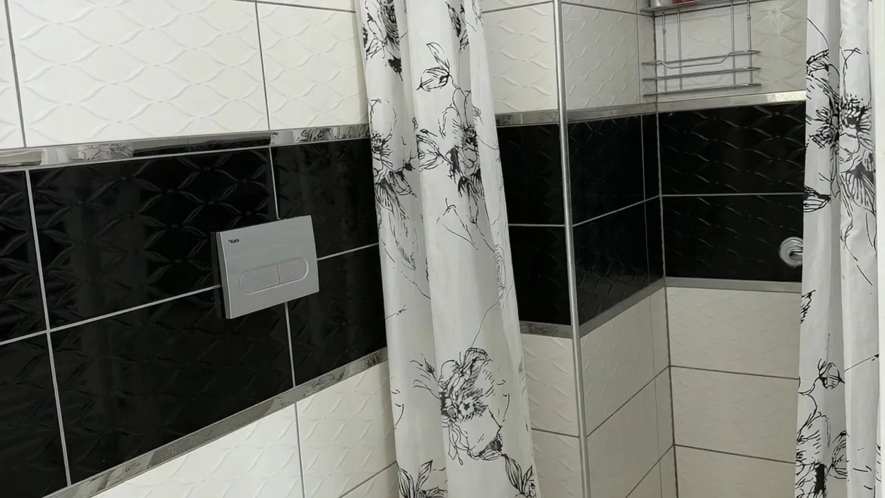 Motion-constrained property photo example 1: Bathroom wall dominates the frame